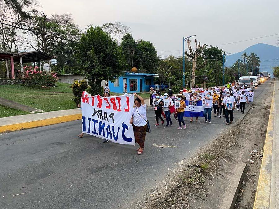 Protestors carrying signs during the Mothers March